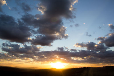 Low angle view of dramatic sky during sunset