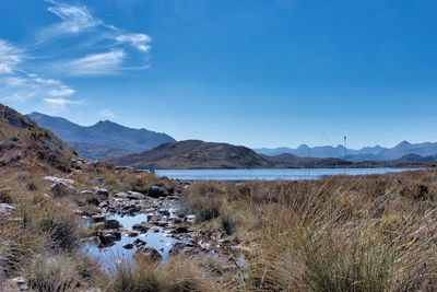 View of lake with mountain range in background