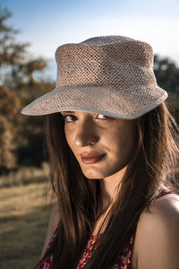 Portrait of smiling young woman standing outdoors