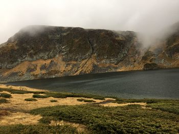 Scenic view of landscape and mountains against sky