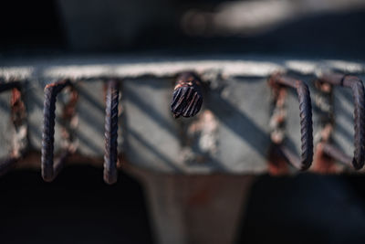 Close-up of rusty metal on wood