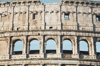 Detail of the ancient colosseum of rome located in the city center, travel reports