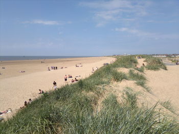 High angle view of people enjoying on beach