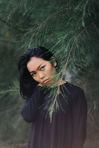 Portrait of young woman in forest