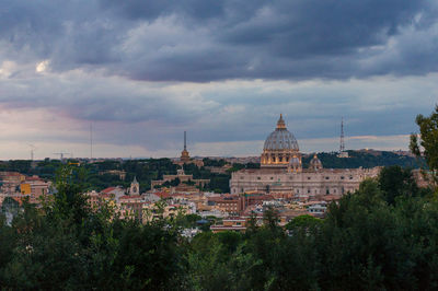 Aerial view of illuminated st. peters basilica, or papal basilica and vatican at sunset