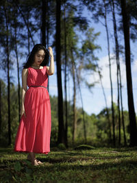 Woman standing in a forest