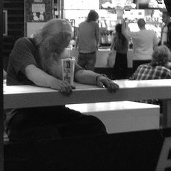 Close-up of woman sitting on bench