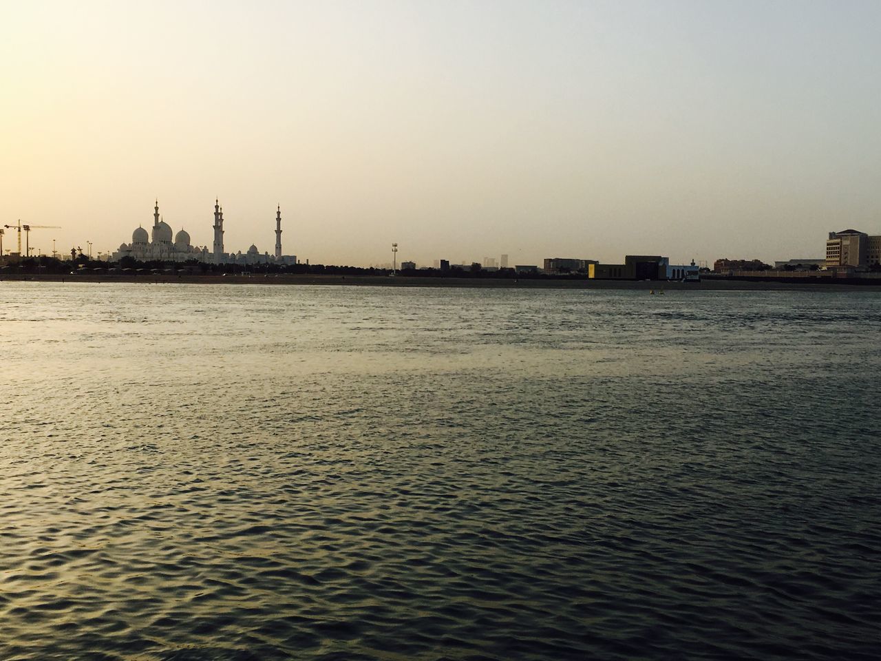 waterfront, water, built structure, industry, river, no people, sunset, architecture, outdoors, sky, building exterior, nature, clear sky, day, factory, city, drilling rig