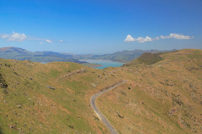 Scenic view of landscape against blue sky