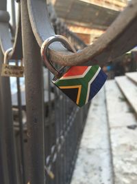 Close-up of padlocks on railing