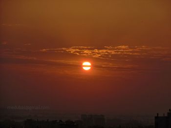 Scenic view of sunset over city