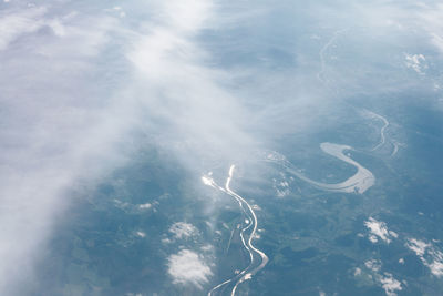 Flowing river and clouds view from above . aerial view of nature