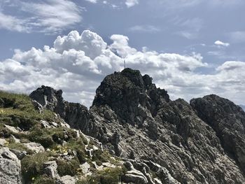 Low angle view of rock formation against sky