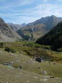 Scenic view of landscape and mountains against sky