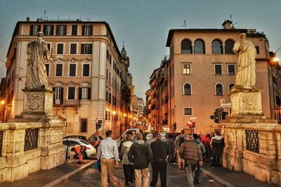 People on street in city at night