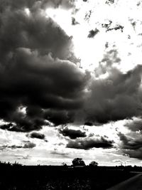 Low angle view of silhouette landscape against sky