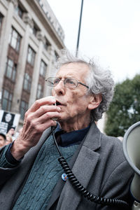 Portrait of man drinking glasses