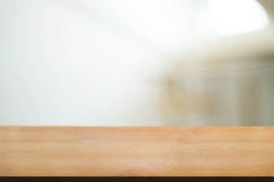Close-up of wooden table at home