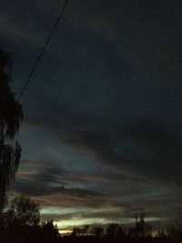 Silhouette trees against sky during sunset