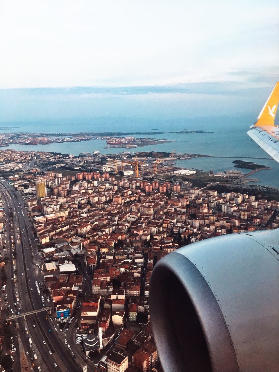 AERIAL VIEW OF CITY BUILDINGS SEEN THROUGH AIRPLANE