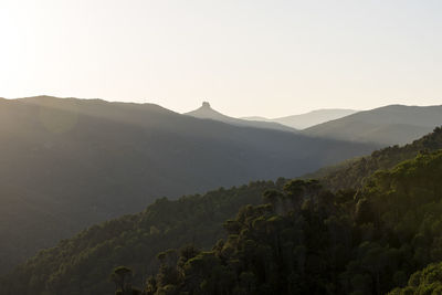 Scenic view of mountain s against clear sky at golden hour sunset in sardinia, italy.