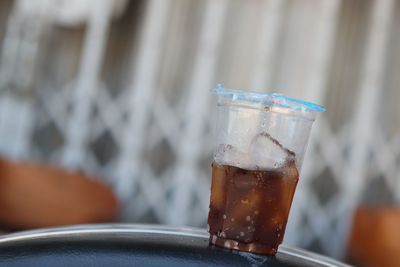 Close-up of ice cream on glass table