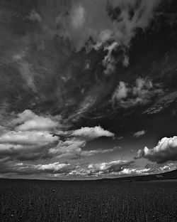 Scenic view of landscape against cloudy sky