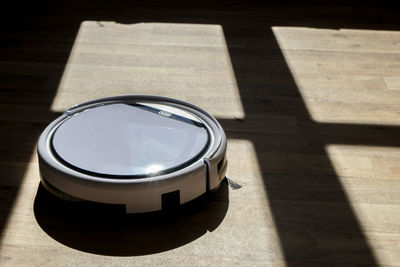 High angle view of cleaning equipment on hardwood floor