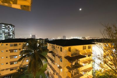 Buildings in city at night