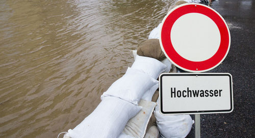 High angle view of information sign by river