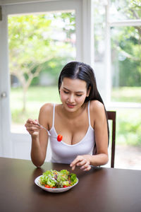 Young woman eating food