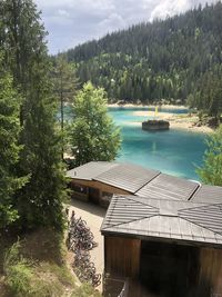 Scenic view of lake in forest against sky