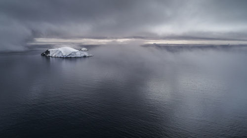 Scenic view of sea against sky during winter