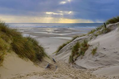 Scenic view of beach against sky