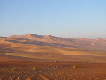 Scenic view of desert against clear sky