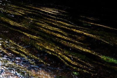 Full frame shot of rock in water at night