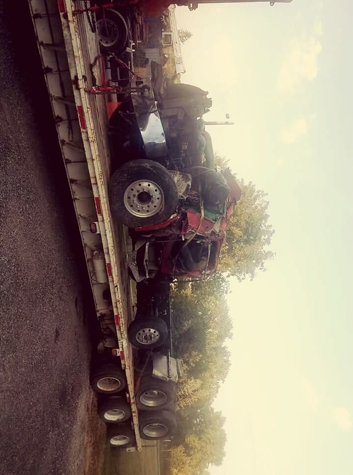 MOTORCYCLE PARKED AGAINST SKY