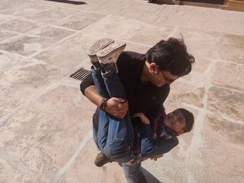 High angle view of father with daughter