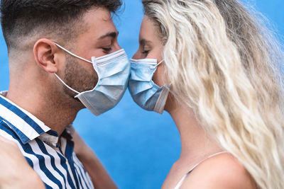 Portrait of couple kissing