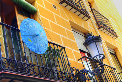 Low angle view of yellow building against sky