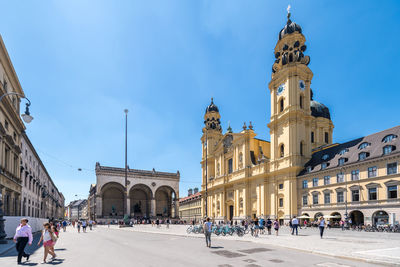 Group of people in front of building in city