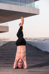 Full length of man with arms raised