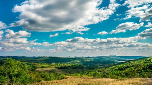 Scenic view of landscape against cloudy sky