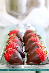 Close-up of strawberries and chocolate dessert in plate