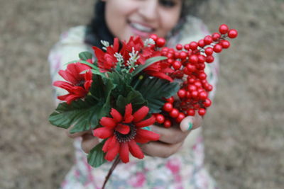 Close-up of woman holding flowers