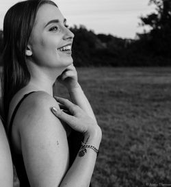 Portrait of a smiling young woman looking away