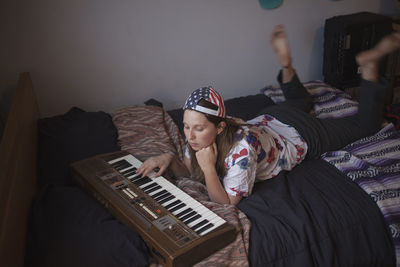 Young woman playing a keyboard