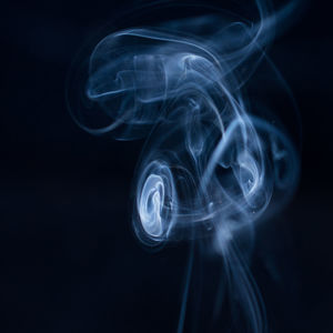 Close-up of smoke against black background