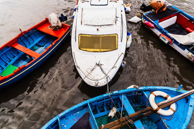 High angle view of fishing boats moored at harbor