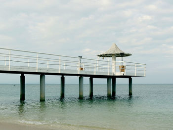 Pier over sea against sky